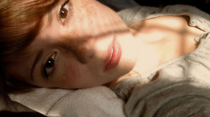 lying down, brown eyes, freckles