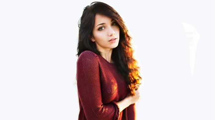 white background, arms crossed, blue eyes, girl, sunlight, model, emily rudd, brunette, sweater, looking at viewer