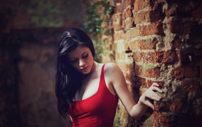 bricks, dark hair, looking down, girl